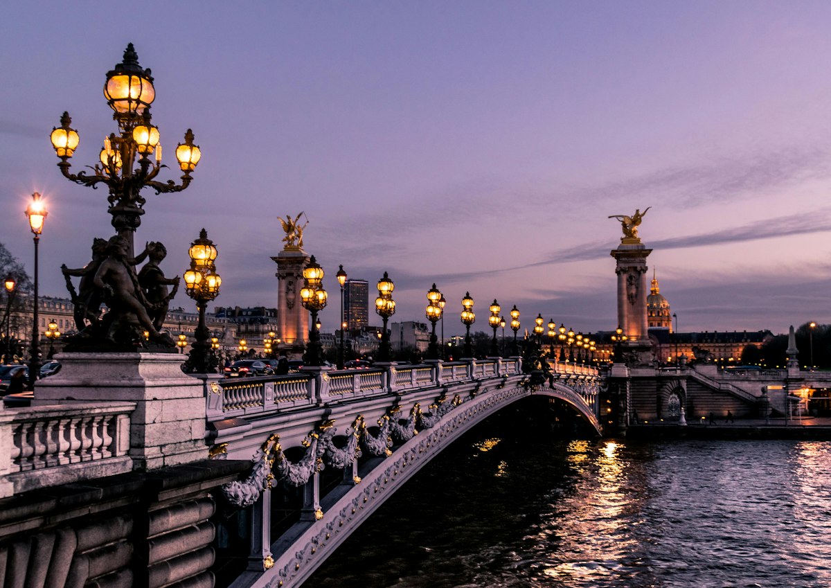Historic European city boulevard with classical Parisian architecture in golden afternoon light