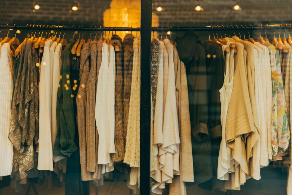 Curated minimalist capsule wardrobe with tailored neutral coats and elegant essentials