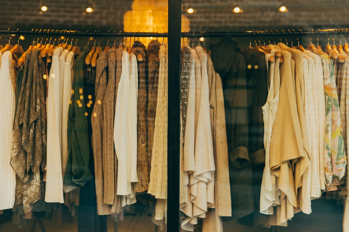 Curated minimalist capsule wardrobe with tailored neutral coats and elegant essentials